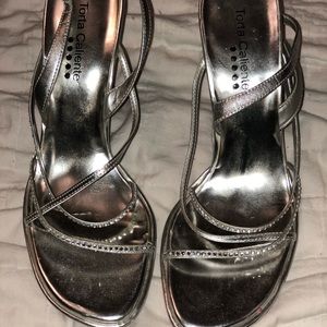 Silver high heels worn twice